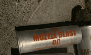 40mm shell with orange writing that says CM muzzle blast OC